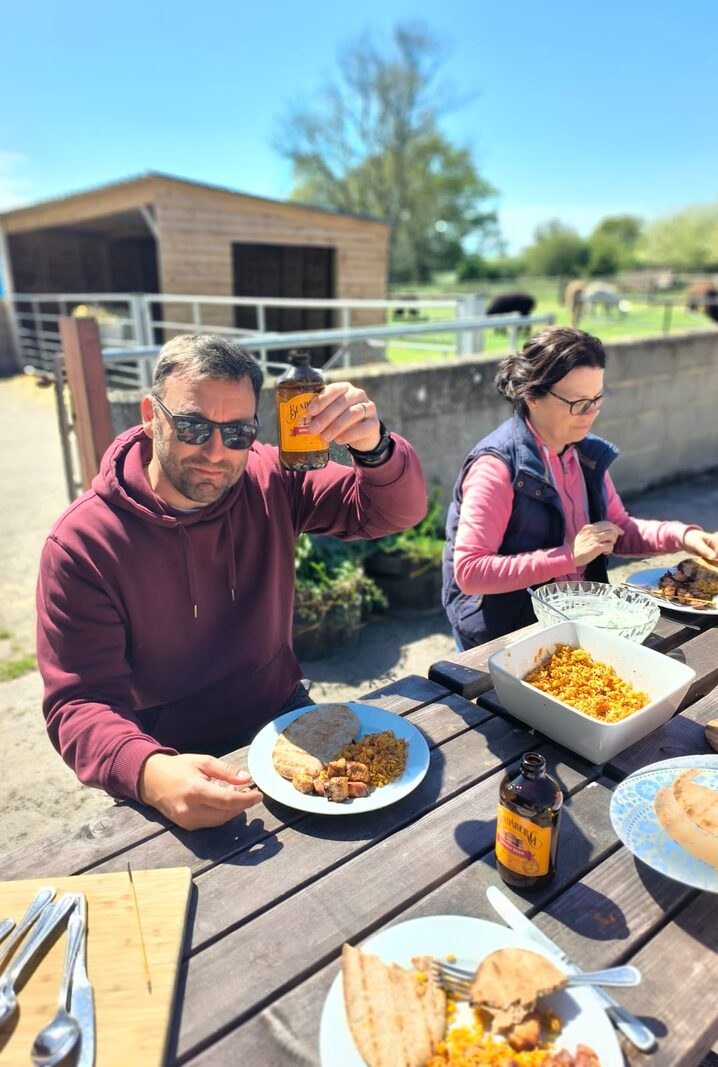 Guests enjoying an outdoor lunch at the farm during the dog training holiday